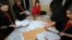 AZERBAIJAN -- Members of a local electoral commission count ballots at a polling station after a snap parliamentary election in Baku, February 9, 2020