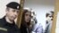 Russia -- The two former members of anti-Kremlin Russian punk group Pussy Riot, Nadezhda Tolokonnikova and Maria Alyokhina, attend a court hearing in Moscow, January 9, 2014