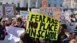 U.S. -- Thousands of local students protest as they rally during a nationwide student walkout for gun control in front the White House in Washington, March 14, 2018
