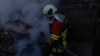 Ukraine -- Rescue workers at the site of Russian strike, Kyiv, 7Apr2025