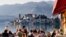 LAKE ORTA, ITALY - FEB 24: People in a restaurant in Orta on February 24, 2012. With the nearby Unesco site Sacro Monte and San Giulio island, Orta is a popular destination for small-scale tourism.