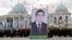 TURKMENISTAN -- People carry a picture of Turkmen President Gurbanguly Berdymukhammedov to mark Turkmenistan's Independence Day in Ashgabat on October 27, 2009.