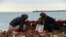 Russia -- People lay flowers next to a portrait of one of the victims, famous Russian charity activist and founder of the Voters' League Elizaveta Glinka or Dr Liza, at a makeshift memorial at the embankment on the shore of the Black Sea in Sochi, on Dece