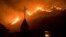 U.S. -- Flames from a wildfire advance down a hillside near the Springs of Life Church in Casitas Springs, Calif., on Tuesday, Dec. 5, 2017.