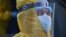 ARMENIA == A medical worker wearing protective gear is seen outside the Grigor Lusavorich Medical Centre in Yerevan, June 9, 2020