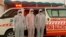 PAKISTAN -- Pakistani medical staff stand at the Pakistan-Iran border, which was closed due to the outbreak of coronavirus in neighboring Iran, in Taftan, February 25, 2020
