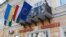 UKRAINE -- Flags (R to L) of EU, Hungary, Ukraine, Berehove and inscriptions in two languages, Ukrainian and Hungarian, fly on a city hall building in Berehove, a small town in western Ukraine, November 15, 2017